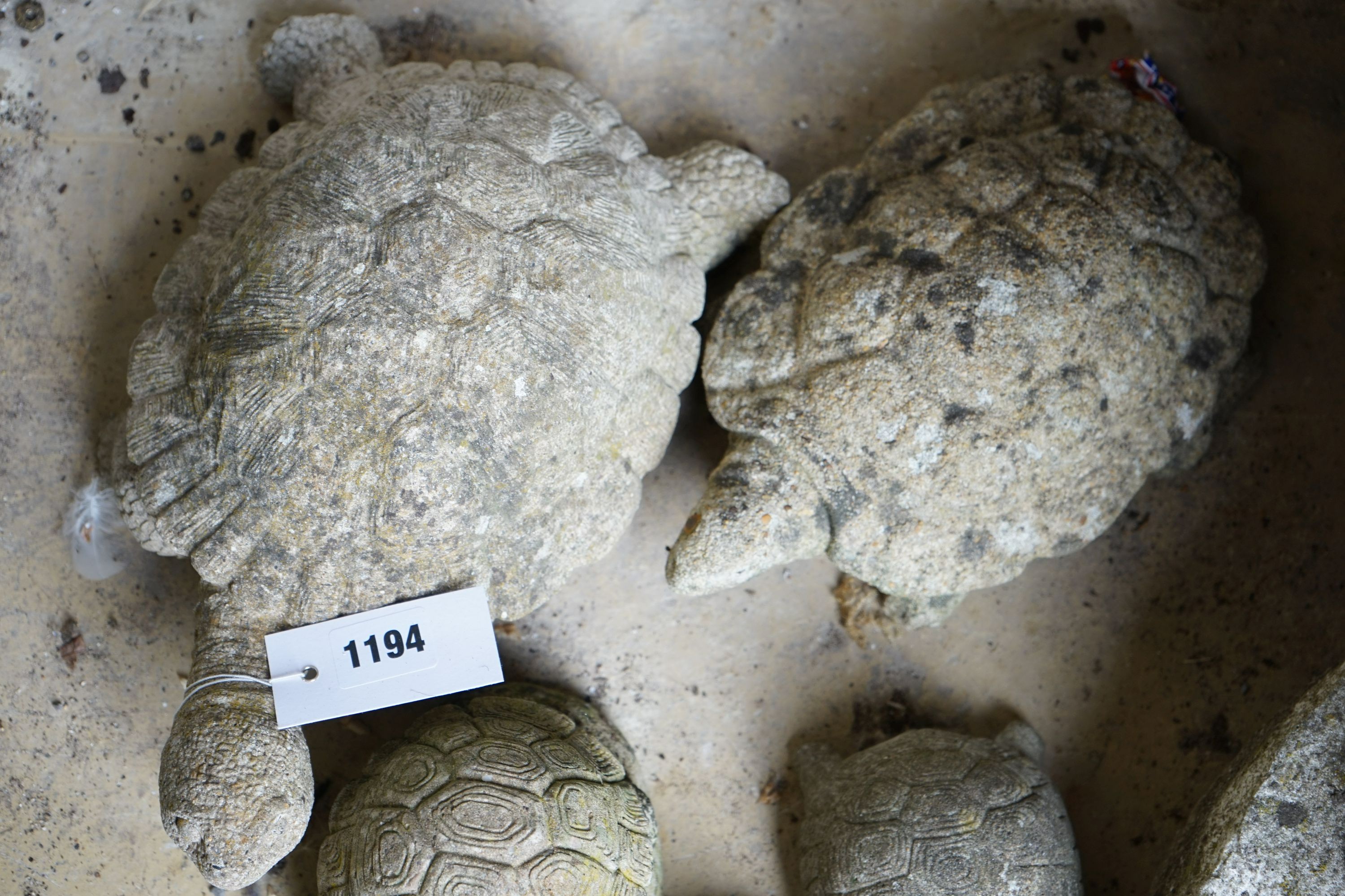Five reconstituted stone tortoise garden ornaments, largest length 28cm